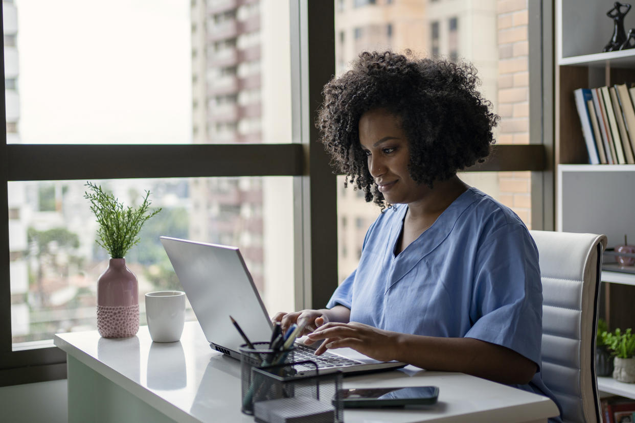 African American nurse working on the desk