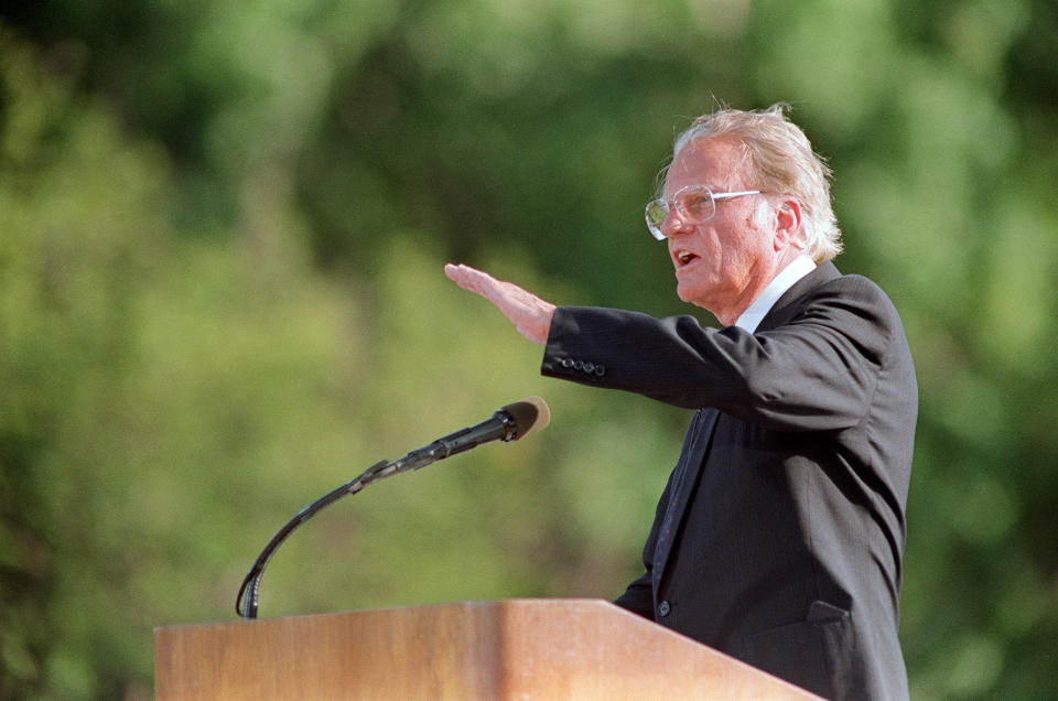 NEW YORK, NY - SEPTEMBER 22:  Billy Graham, the American evangelist, preaches 22 September 1991 in front of an estimated crowd of 200,000 faithful gathered in Central Park, for the first time in New York since 1970. Graham, (son of a dairy farmer, born in 1918 in Charlotte, NC), attended Florida Bible Institute and was ordained a Southern Baptist minister in 1939 and quickly gained a reputation as a preacher. During the 1950s he conducted a series of highly organized revivalist campaigns in the USA and UK, and later in South America, the USSR and Western Europe.  (Photo credit should read MARIA BASTONE/AFP/Getty Images)