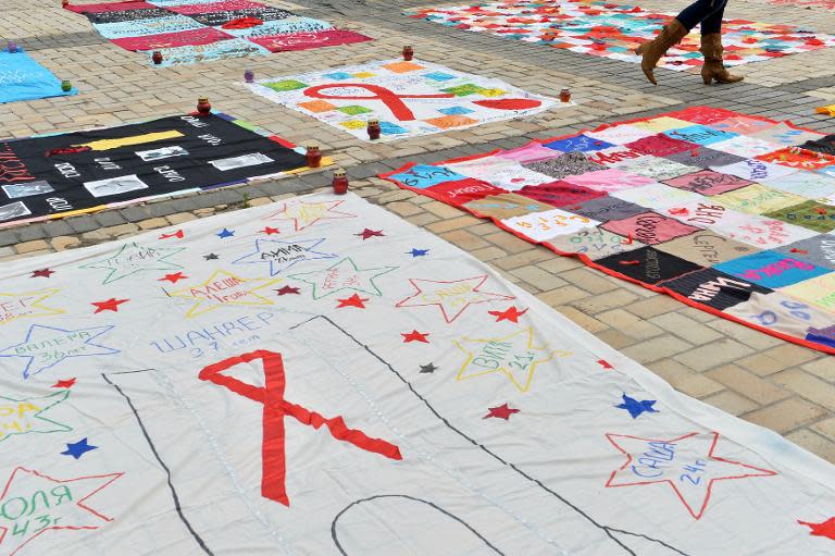 Quilts embroidered with the names of AIDS victims are displayed during a ceremony to mark World Remembrance Day of AIDS Victims on Saint Sophia square in Kiev on May 18, 2014