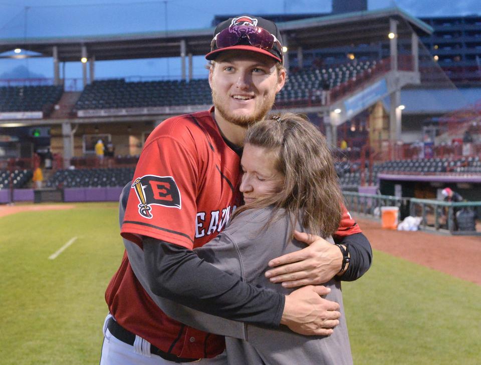 Erie SeaWolves outfielder Parker Meadows, 22, hugs his mother Staci Meadows, 53, after a game against the Altoona Curve at UPMC Park in Erie on May 6, 2022. It was  the first home game that Staci Meadows was able to attend since Parker was promoted from West Michigan. Austin Meadows (not pictured), Parker's older brother, is an outfielder for the Detroit Tigers.