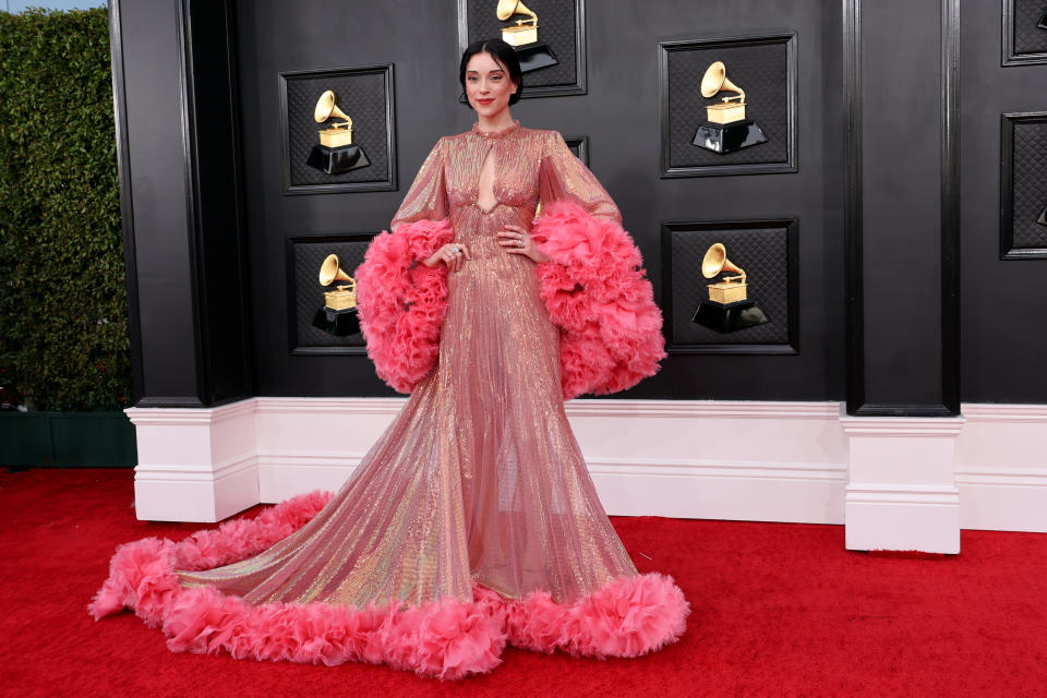 <p>The "Down" singer looked straight off the runway in a dramatic ruffled pink gown by Gucci. (Image via Getty Images)</p> 