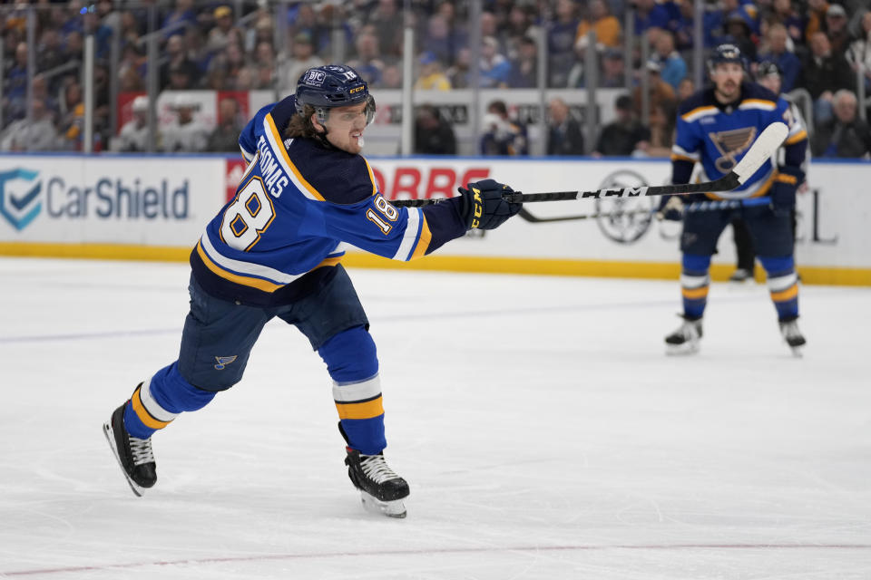 St. Louis Blues' Robert Thomas scores during the second period of an NHL hockey game against the Vancouver Canucks Tuesday, March 28, 2023, in St. Louis. (AP Photo/Jeff Roberson)