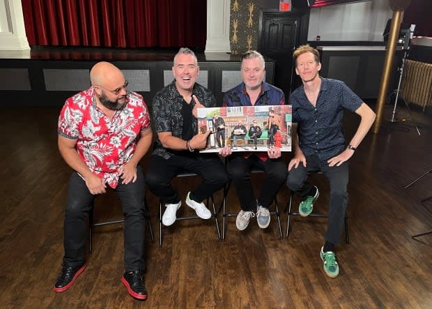 Barenaked Ladies hold their new album, Detour de Force. (Jennifer Gosnell/CBC - image credit)