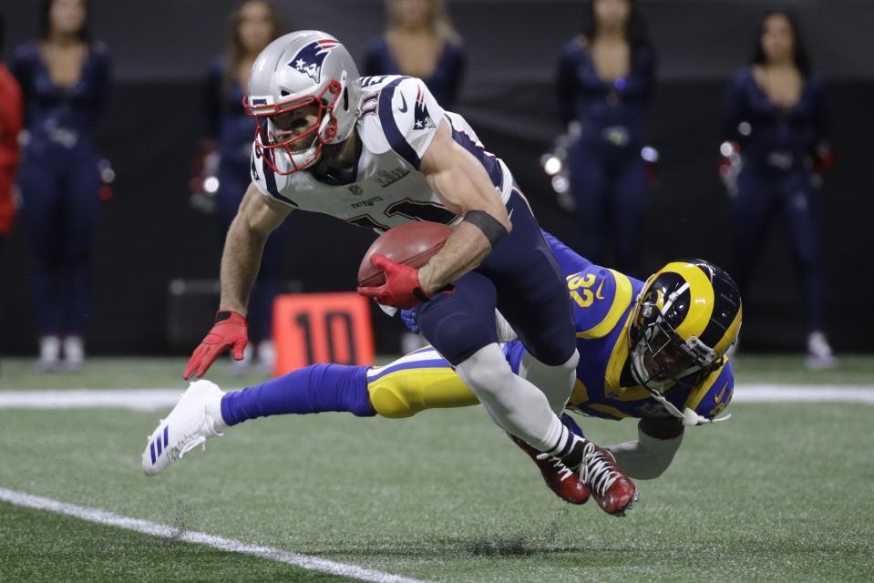 <p>New England Patriots’ Julian Edelman (11) breaks away from Los Angeles Rams’ Troy Hill, right, during the first half of the NFL Super Bowl 53 football game Sunday, Feb. 3, 2019, in Atlanta. (AP Photo/Patrick Semansky) </p>