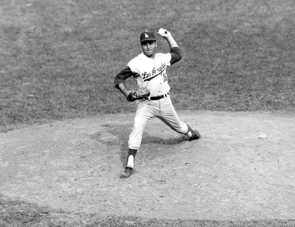 FILE - In this Aug. 17, 1963, file photo, Los Angeles Dodgers pitcher Ron Perranoski throws against the New York Mets at the Polo Grounds in New York. Perranoski, one of the Dodgers' greatest lefthanded relievers of all-time, passed away at the age of 84 on Friday, Oct. 2, 2020, at his home in Vero Beach, Fla. (AP Photo/John Rooney, File)