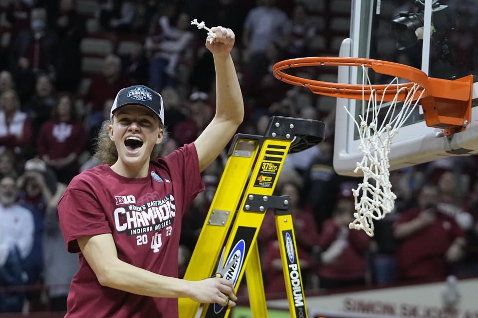 Indiana's Grace Berger celebrates after her team defeated Purdue in an NCAA college basketball game, Sunday, Feb. 19, 2023, in Bloomington, Ind. (AP Photo/Darron Cummings)