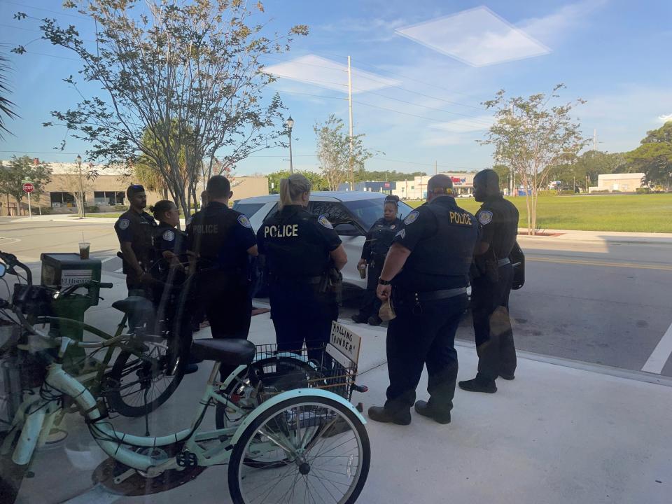 About a dozen officers, mostly Fort Pierce police, get coffee and breakfast at Mervis Cafe in Fort Pierce, Fla., before heading to the Alto Lee Adams Sr. U.S. Courthouse on U.S. 1 at Orange Avenue, where a pretrial hearing is slated Tuesday, July 18, 2023, in advance of a federal criminal trial for former President Donald Trump and his valet Waltine "Walt" Nauta.
