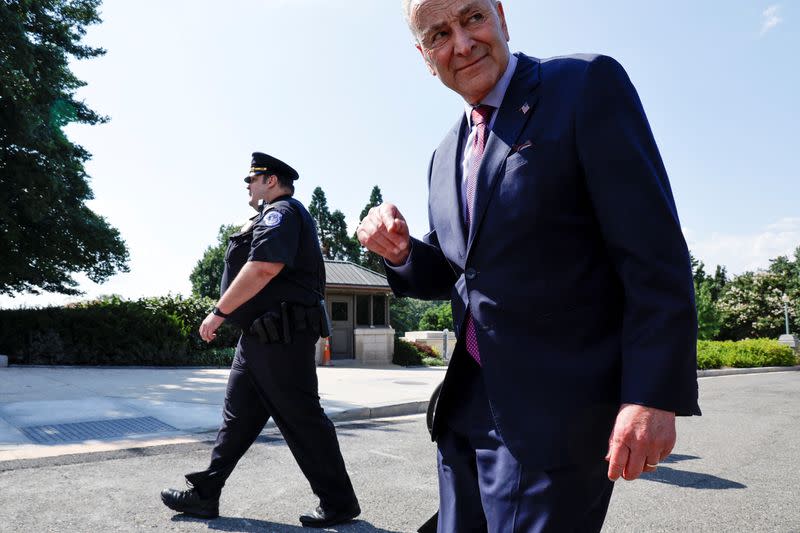 U.S. Senate Majority Leader Schumer celebrates with activists after a breakthrough to allow a vote on expanding healthcare to veterans at the U.S. Capitol in Washington