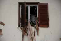 <p>A TV set and curtains are stuck on a destroyed window of a flooded house, following flash floods which hit areas west of Athens on November 15 killing at least 15 people, in Mandra, Greece, Nov. 16, 2017. (Photo: Alkis Konstantinidis/Reuters) </p>