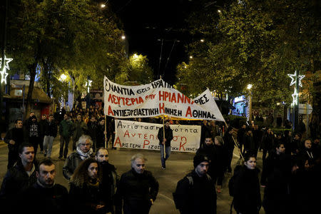 People attend an anniversary rally marking the 2008 police shooting of 15-year-old student, Alexandros Grigoropoulos, in Athens, Greece, December 6, 2017. REUTERS/Costas Baltas