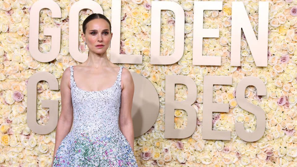 Natalie Portman wore a sequined floral masterpiece by Dior Haute Couture, Jimmy Choo shoes and De Beers diamond earrings and eternity band. - Mike Blake/Reuters