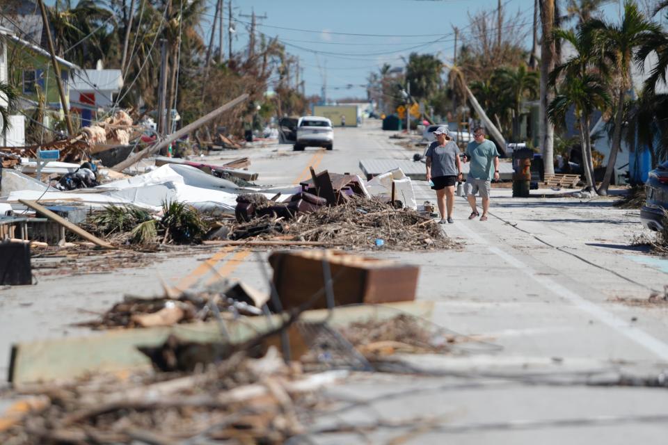 Debris is scattered throughout what remains of Pine Island Road in Matlacha on Sunday Oct. 2, 2022, after the impact of Hurricane Ian.