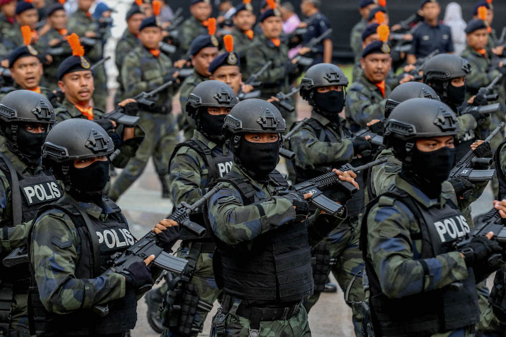 Royal Malaysia Police personnel march during a National Day rehearsal in Putrajaya August 29, 2019. — Picture by Firdaus Latif