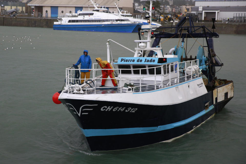 A French trawler coming from the British waters arrives at the port of Granville, Normandy, Monday, Nov. 1, 2021. France has threatened to bar British boats from some of its ports and tighten checks on boats and trucks carrying British goods if more French vessels aren't licensed to fish in U.K. waters by Tuesday Oct.2, 2021. French fishing crews stood their ground, demanding a political solution to a local dispute that has become the latest battleground between Britain and the European Union. (AP Photo/Nicolas Garriga)