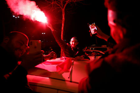 Supporters of AK Party light a flare in Istanbul, Turkey April 1, 2019. REUTERS/Kemal Aslan