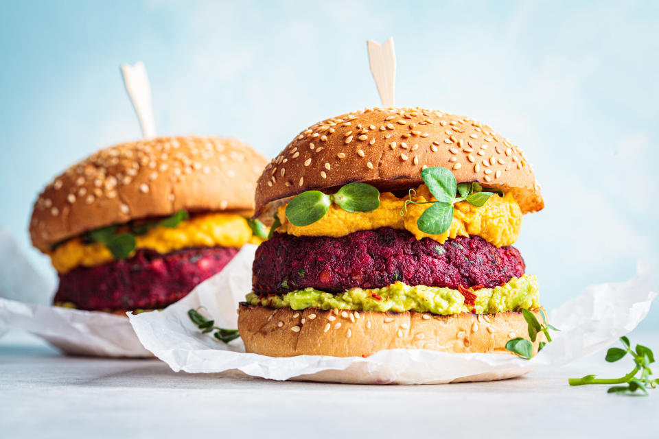 Vegan burger with beetroot cutlet, sweet potato sauce and guacamole.