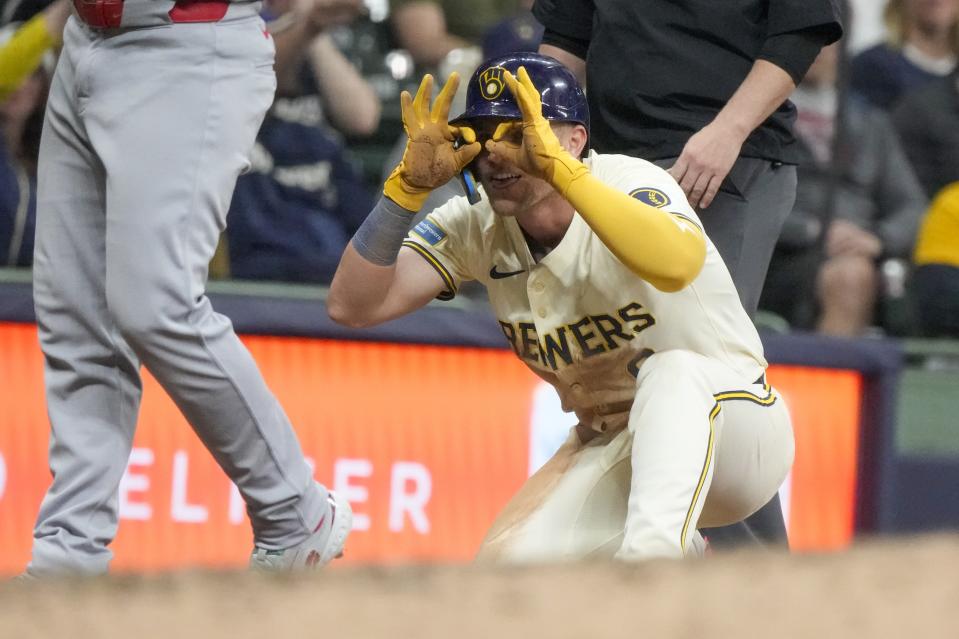 Milwaukee Brewers' Jake Bauers reacts after hitting a two-run scoring triple during the seventh inning of a baseball game against the St. Louis Cardinals Friday, May 10, 2024, in Milwaukee. (AP Photo/Morry Gash)