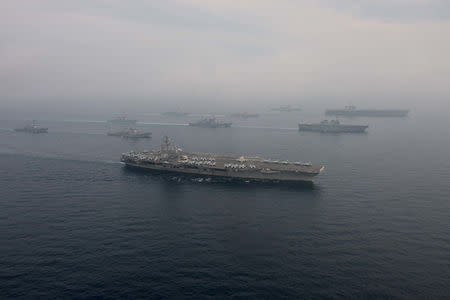 The U.S. Navy aircraft carriers USS Ronald Reagan (front) and USS Carl Vinson and (back R) sail with their strike groups and Japanese naval ships during training in the Sea of Japan, June 1, 2017. U.S. Navy/Mass Communication Specialist 2nd Class Z.A. Landers/Handout via REUTERS