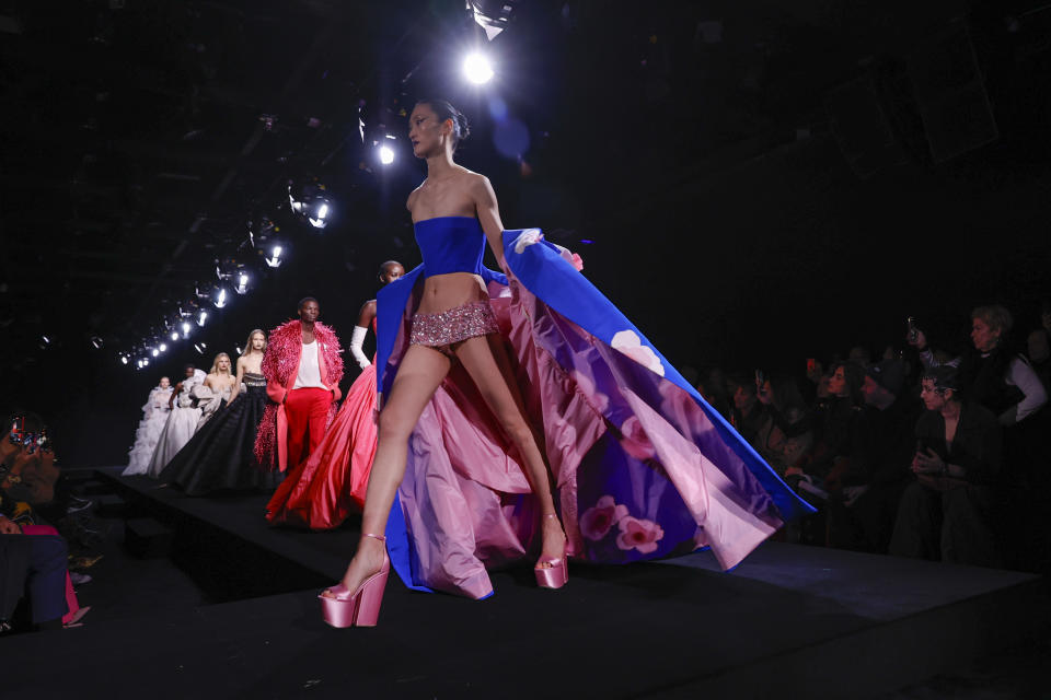 A model wears a creation as part of the Valentino Haute Couture Spring-Summer 2023 collection presented in Paris, Wednesday, Jan. 25, 2023. (AP Photo/Lewis Joly)