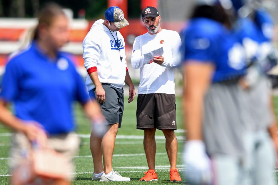 BEREA, OH - AUGUST 19: Head Coach Kevin Stefanski of the Cleveland Browns talks with head coach Joe Judge of the New York Giants during a joint practice on August 19, 2021 in Berea, Ohio. (Photo by Nick Cammett/Getty Images)