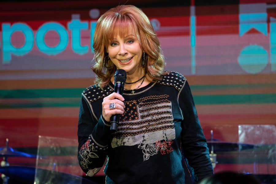 FILE – Reba McEntire performs during the 2023 CMA Fest on Friday, June 9, 2023, at the Spotify House in Nashville, Tenn. McEntire will grace next month’s Super Bowl stage to sing the national anthem while Post Malone will perform “America the Beautiful.” (Photo by Amy Harris/Invision/AP)