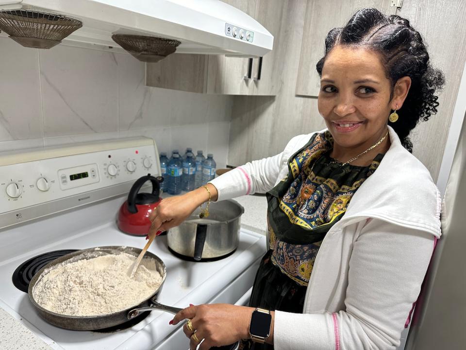 Edom Gebremichael toasts barley flour to make a traditional porridge, considered to be very healthy for breastfeeding mothers. 