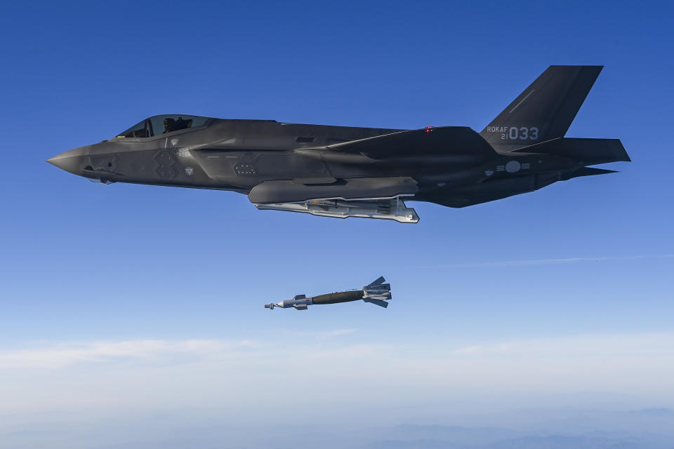 In this photo provided by South Korean Defense Ministry, South Korean Air Force F-35 fighter jet fires a GBU-12 aerial laser-guided bomb at a firing range near its land border with North Korea, South Korea, Friday, Nov. 18, 2022. Later Friday, South Korea's military said its F-35 fighter jets conducted drills simulating aerial strikes on North Korean mobile missile launchers at a firing range near its land border with North Korea. It said a group of eight South Korean and U.S. fighter jets separately performed flight training off the Korean Peninsula's east coast. (South Korean Defense Ministry via AP)