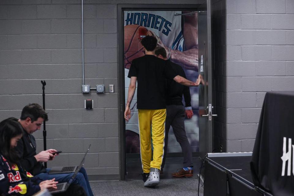 Hornets guard LaMelo Ball leaves the interview room wearing a walking boot on his right ankle, an injury that took him out of play for the remainder of the season.