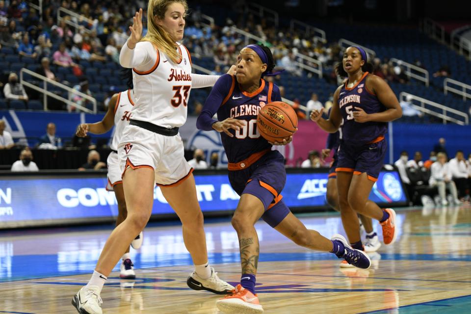 Virginia Tech center Elizabeth Kitley defends Clemson  guard Delicia Washington (00) during the first quarter of their game at Greensboro Coliseum Complex.