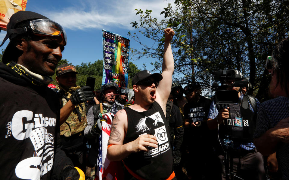 <p>Supporters of the Patriot Prayer group cheer during a rally in Portland, Ore., Aug. 4, 2018. (Photo: Bob Strong/Reuters) </p>