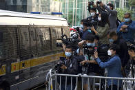 Photographers cover democracy advocate Jimmy Lai arriving at Hong Kong's Court of Final Appeal where the government is arguing against allowing him bail in Hong Kong Monday, Feb. 1, 2021. Lai is charged with "collusion" under the new National Security Law that Beijing imposed on Hong Kong last year. (AP Photo/Vincent Yu)