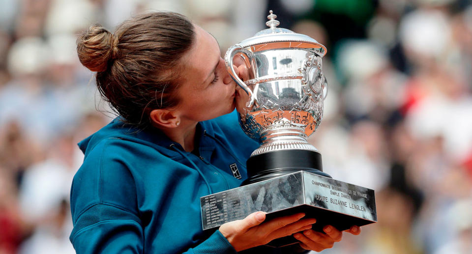 Simona Halep is seen here lifting the 2018 French Open trophy. Pic: Getty