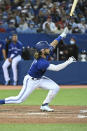 Toronto Blue Jays' Bo Bichette watches his solo home run in the fifth inning of a baseball game against the Tampa Bay Rays in Toronto on Monday, Sept. 13, 2021. (Jon Blacker/The Canadian Press via AP)