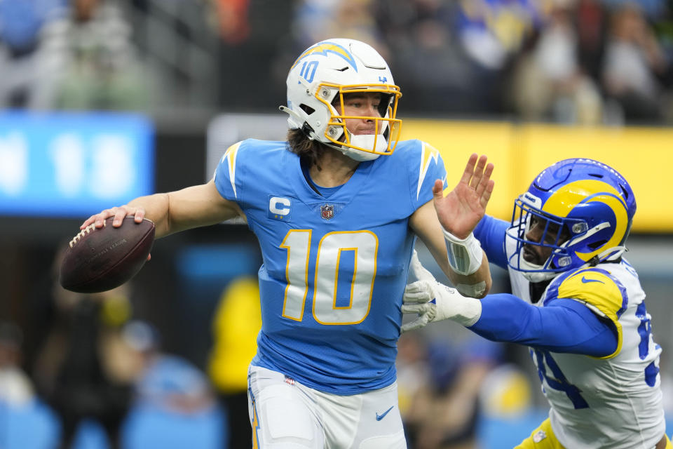 Los Angeles Chargers quarterback Justin Herbert (10) looks to throw a pass during the first half of an NFL football game against the Los Angeles Rams Sunday, Jan. 1, 2023, in Inglewood, Calif. (AP Photo/Marcio Jose Sanchez)