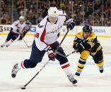 BOSTON, MA - APRIL 25: Alexander Semin #28 of the Washington Capitals takes a shot as Andrew Ference #21 of the Boston Bruins defends in Game Seven of the Eastern Conference Quarterfinals during the 2012 NHL Stanley Cup Playoffs at TD Garden on April 25, 2012 in Boston, Massachusetts. (Photo by Elsa/Getty Images)