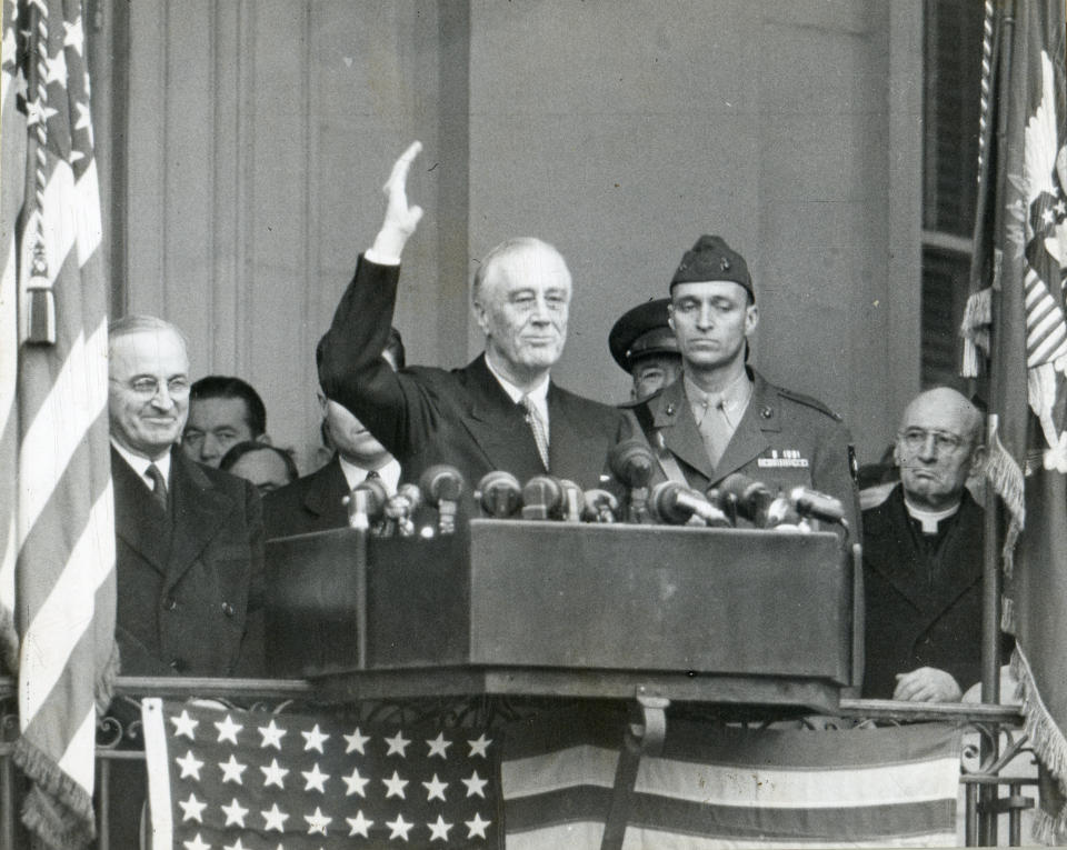 Franklin D.&nbsp;Roosevelt waves from a lectern just after taking his fourth&nbsp;oath of office&nbsp;on Jan. 20, 1945.