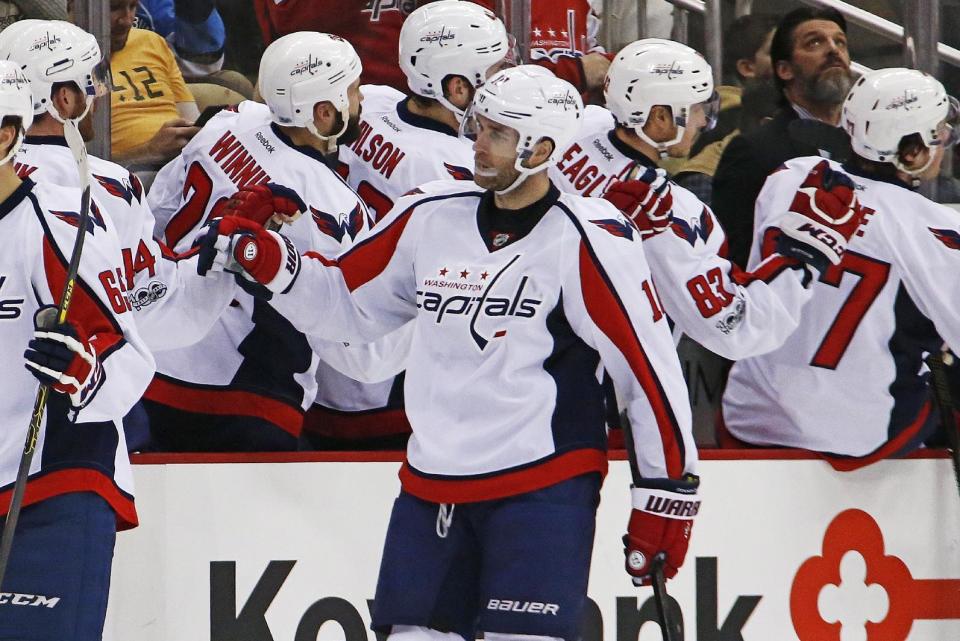 Washington Capitals' Brett Connolly (10) celebrates with teammates as he returns to the bench after scoring in the second period of an NHL hockey game against the Pittsburgh Penguins in Pittsburgh, Monday, Jan. 16, 2017. (AP Photo/Gene J. Puskar)