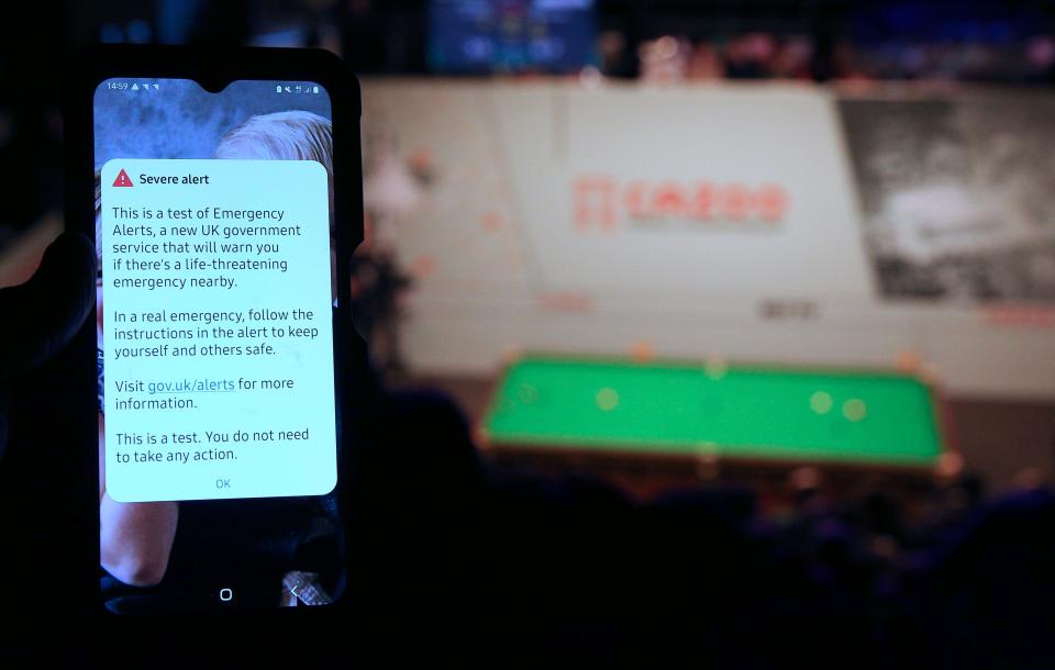 A spectators phone shows the 3 pm National Alert Test during the match between Jack Lisowski and Anthony McGill during day nine of the Cazoo World Snooker Championship at the Crucible Theatre, Sheffield. Picture date: Sunday April 23, 2023.