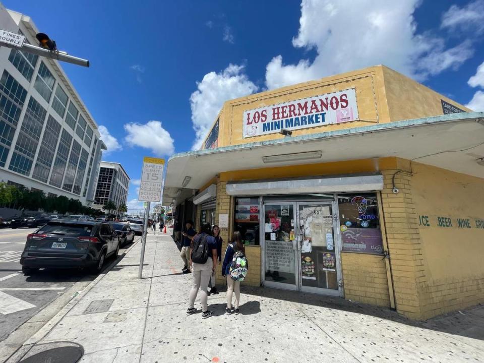 SLAM! Miami students speak among each other at the corner of Northwest 12th Avenue and Fifth Street on Thursday afternoon, May 2, 2024.