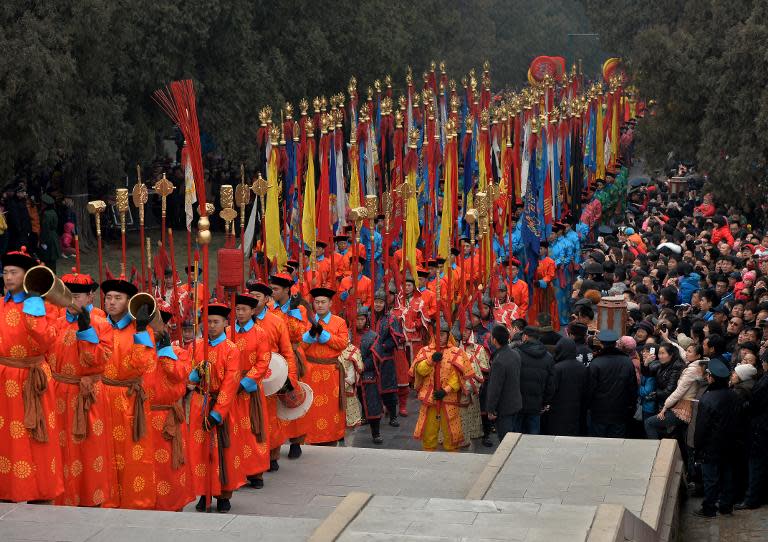 Chinese performers take part in a traditional Qing Dynasty ceremony in which emperors prayed for good fortune, during Lunar New Year festivities at the Temple of Heaven in Beijing, on January 31, 2014