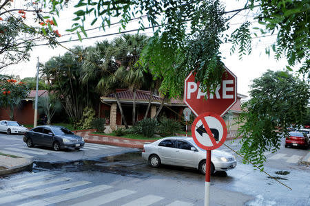 Cars drive past the house of Nicolas Leoz, former head of South America's football federation CONMEBOL and who has been under house arrest since mid-2015, in Asuncion, Paraguay November 16, 2017. REUTERS/Jorge Adorno