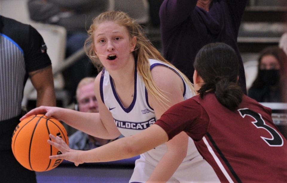 ACU's Kamryn Mraz, left, looks to pass the ball as New Mexico State's Melanie Isbell defends in the fourth quarter.