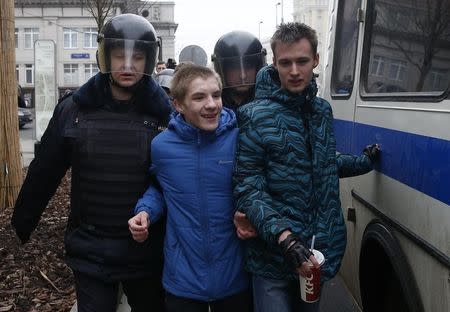 Policemen detain young men while patrolling streets in the case of an anti-government protest, which was not sanctioned by the authorities, in Moscow, Russia, April 2, 2017. REUTERS/Maxim Shemetov