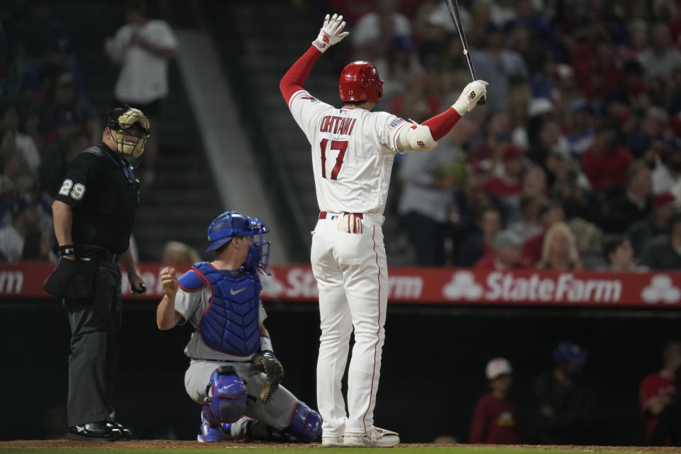 Los Angeles Angels designated hitter Shohei Ohtani (17) reacts after hitting a foul ball in to the dugout during the sixth inning of a baseball game against the Los Angeles Dodgers in Anaheim, Calif., Tuesday, June 20, 2023. (AP Photo/Ashley Landis)