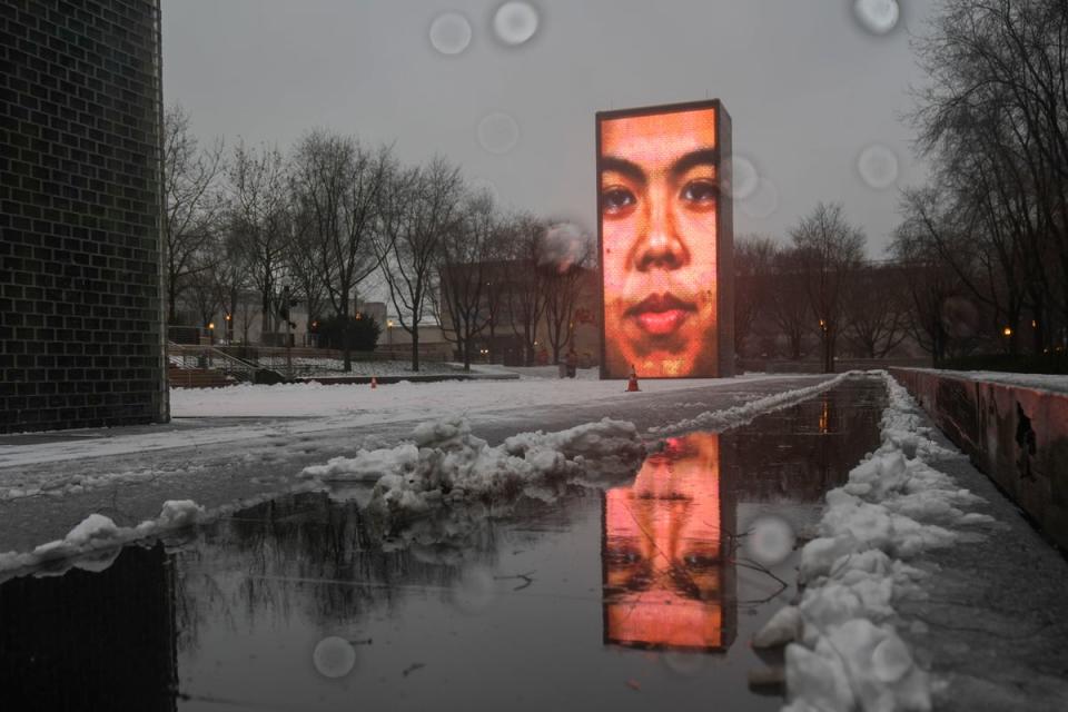 Snow falls on the Crown Fountain in Millennium Park during a winter storm, Friday, Jan. 12, 2024, in Chicago (Copyright 2024 The Associated Press. All rights reserved.)