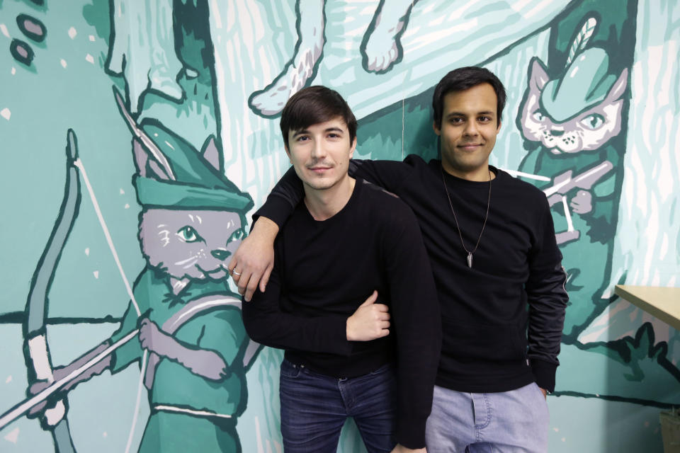 In this Wednesday, Dec. 2, 2015, photo, Robinhood co-founders Vlad Tenev, left, and Baiju Bhatt pose at company headquarters in Palo Alto, Calif. (AP Photo/Ben Margot)