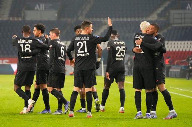 Kylian Mbappe (right) celebrates with his team-mates