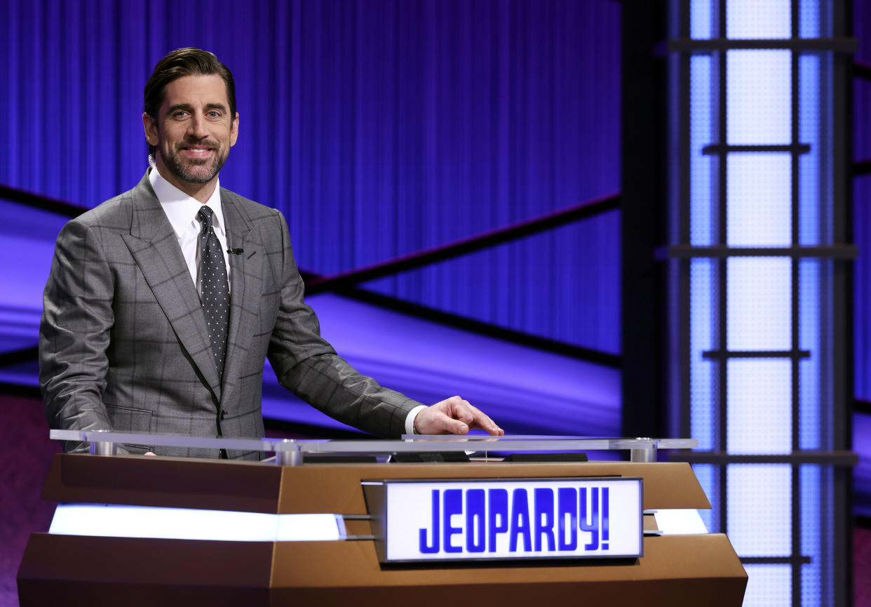 This image released by Jeopardy Productions, Inc. shows Green Bay Packers quarterback Aaron Rodgers as he guest hosts the game show 