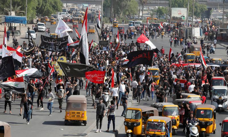 Iraqi students and activists march in Baghdad for protests anniversary, gather in Tahrir square