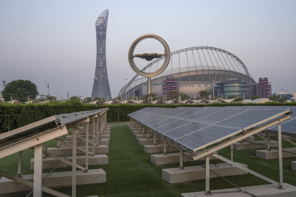 Solar panels sit in front of Khalifa International Stadium, also known as Qatar's National and oldest Stadium, which will host matches during FIFA World Cup 2022, in Doha, Qatar, Saturday, Oct. 15, 2022. (AP Photo/Nariman El-Mofty)